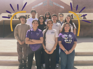 Seniors standing on the stage posing for a picture